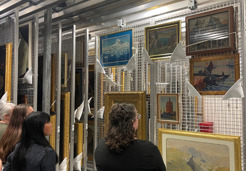 Gazing upon artworks in the storage room